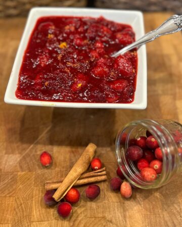 Cranberry Sauce on Counter in white square bowl with spoon in it